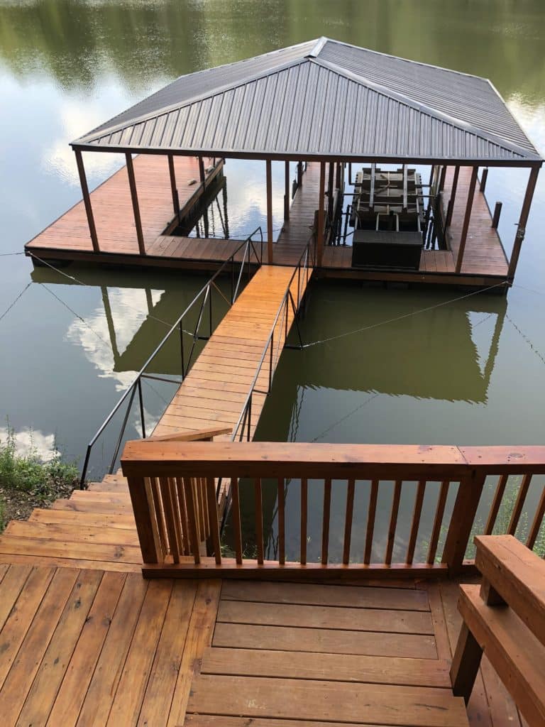 Great steel double slip dock made out of steel. It has wrapped posts, facia and skirt. Has a 30' steel walkway and burnish slate hip roof.
