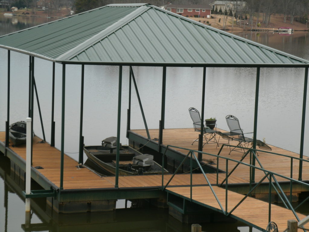 Steel Floating Dock on Lake Bowen with IPE Decking and Green Hip Roof.