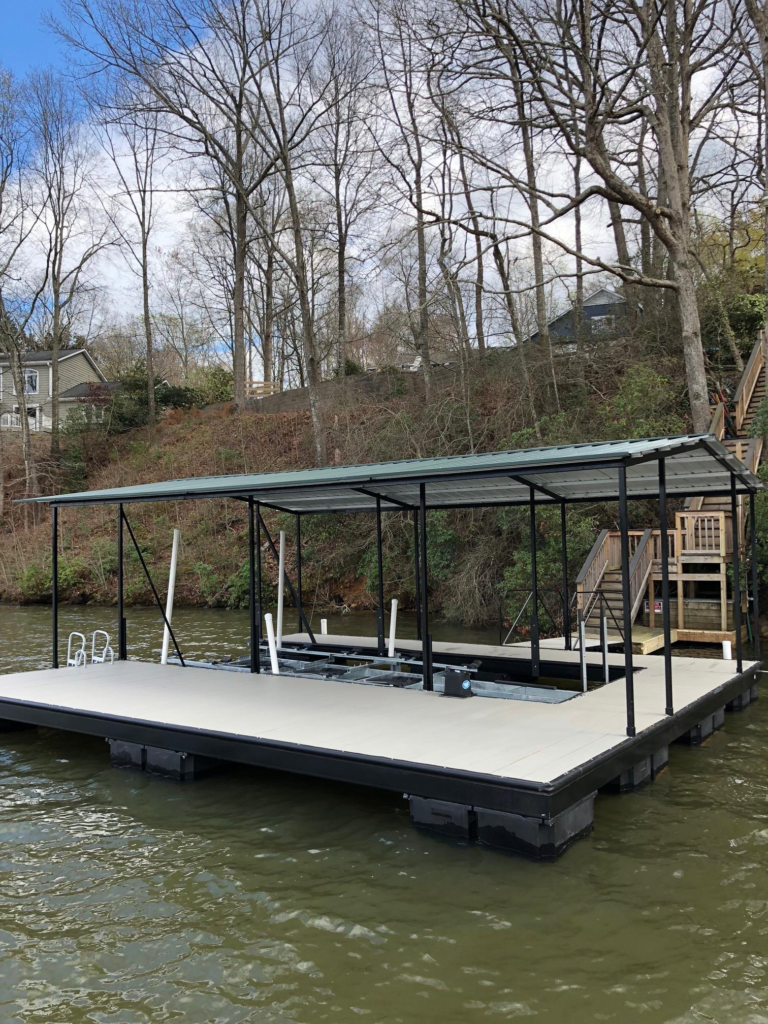 Lake Bowen Steel Floating Dock with Decking and Gable Roof Connected with Steel Walkway.