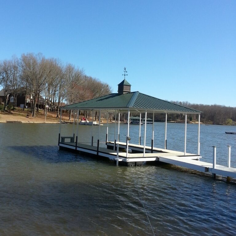 Steel Floating Dock with Aluminum Decking and Green Hip Roof and Weathervane