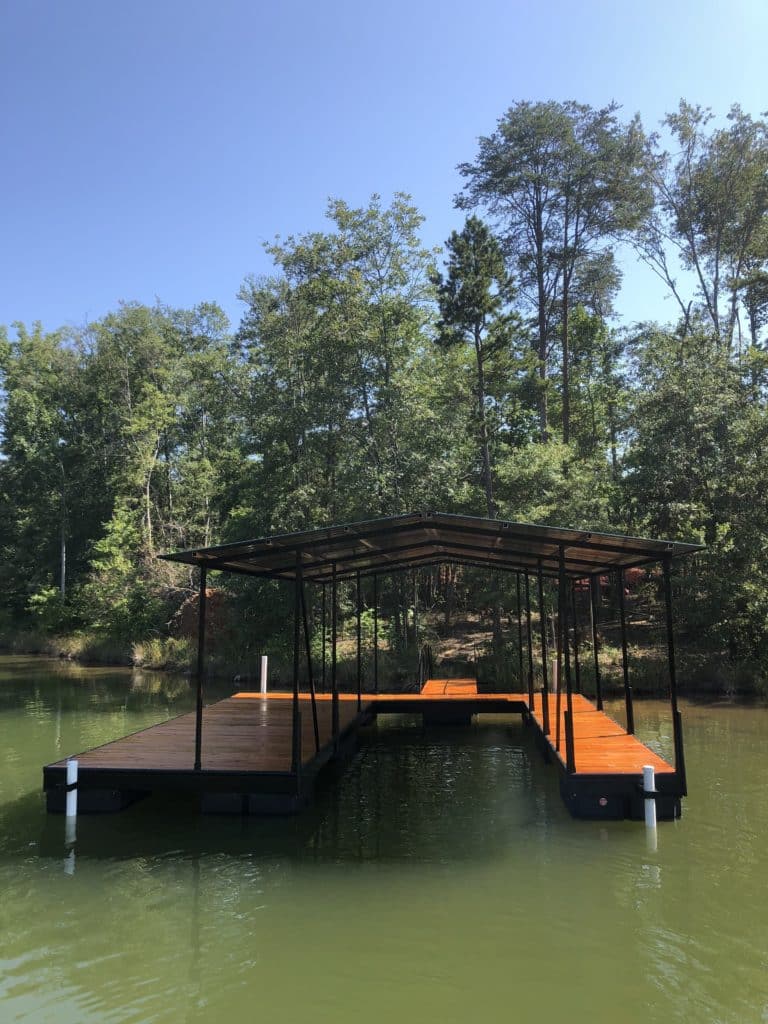 24 by 28 Steel dock, gable roof, wide side left with pressure treated decking stained redwood