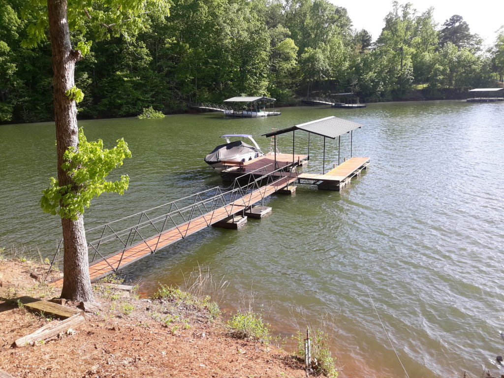 Used 24x24 steel, single slip covered dock with gable roof